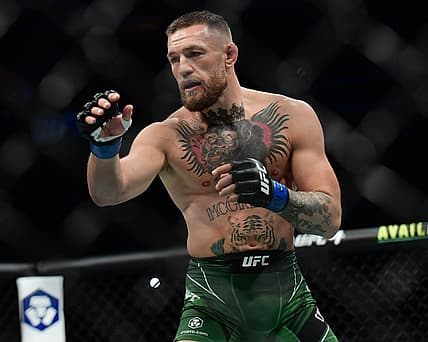 Jul 10, 2021; Las Vegas, Nevada, USA; Conor McGregor fights Dustin Poirier during UFC 264 at T-Mobile Arena. Mandatory Credit: Gary A. Vasquez-USA TODAY Sports