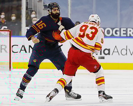 Feb 20, 2021; Edmonton, Alberta, CAN; Edmonton Oilers forward Jujhar Khaira (16) fights Calgary Flames forward Sam Bennett (93) during the first period  at Rogers Place. Mandatory Credit: Perry Nelson-USA TODAY Sports