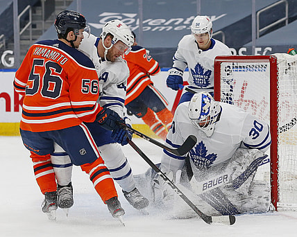 Mar 1, 2021; Edmonton, Alberta, CAN; Toronto Maple Leafs goaltender Michael Hutchinson (30) makes a save against Edmonton Oilers forward Kailer Yamamoto (56) during the first period at Rogers Place. Mandatory Credit: Perry Nelson-USA TODAY Sports