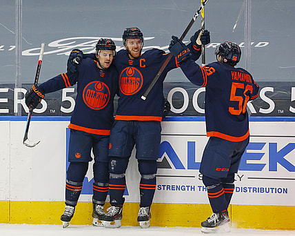 Mar 6, 2021; Edmonton, Alberta, CAN; Edmonton Oilers forward Connor McDavid (97) celebrates after scoring the game winning goal against the Calgary Flames in the third period at Rogers Place. Mandatory Credit: Perry Nelson-USA TODAY Sports