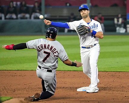 May 3, 2021; Kansas City, Missouri, USA; Kansas City Royals second baseman Whit Merrifield (15) throws to first base after forcing out Cleveland Indians second baseman Cesar Hernandez (7) during the third inning at Kauffman Stadium. Mandatory Credit: Jay Biggerstaff-USA TODAY Sports