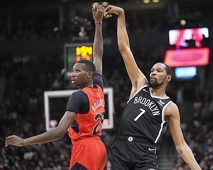 Nov 7, 2021; Toronto, Ontario, CAN; Brooklyn Nets forward Kevin Durant (7) tracks his shot against Toronto Raptors forward Chris Boucher (25) during the first half at Scotiabank Arena. Mandatory Credit: Kevin Sousa-USA TODAY Sports