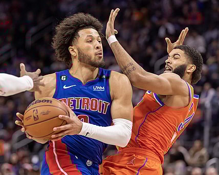 Nov 7, 2022; Detroit, Michigan, USA; Detroit Pistons guard Cade Cunningham (2) drives to the basket on Oklahoma City Thunder forward Kenrich Williams (34) during the in the second half at Little Caesars Arena. Mandatory Credit: David Reginek-USA TODAY Sports