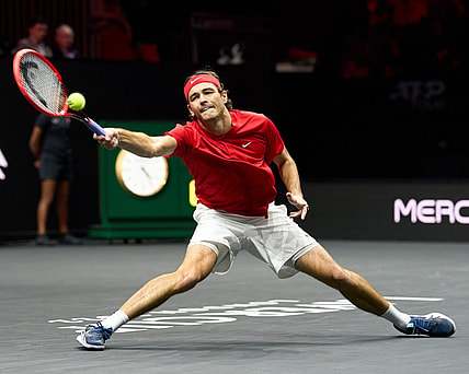 Sep 24, 2022; London, United Kingdom;Taylor Fritz (USA) plays a shot against Cameron Norrie (GBR) in a Laver Cup singles match.  Mandatory Credit: Peter van den Berg-USA TODAY Sports
