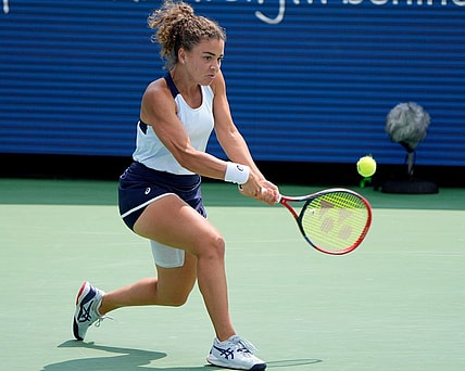 Jasmine Paolini of Italy makes a hit to Coco Gauff of the U.S. during the quarterfinals of the Western & Southern Open at the Lindner Family Tennis Center in Mason Friday, August, 18, 2023.