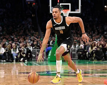 Feb 4, 2024; Boston, Massachusetts, USA; Memphis Grizzlies forward Tosan Evbuomwan (18) dribbles the ball against the Boston Celtics during the second half at TD Garden. Mandatory Credit: Eric Canha-USA TODAY Sports