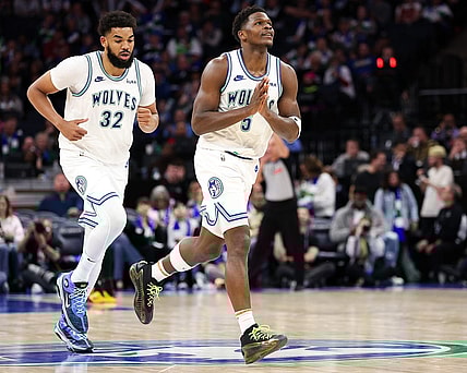 Feb 24, 2024; Minneapolis, Minnesota, USA; Minnesota Timberwolves guard Anthony Edwards (5) celebrates his three-point basket against the Brooklyn Nets during the second half at Target Center. Mandatory Credit: Matt Krohn-USA TODAY Sports
