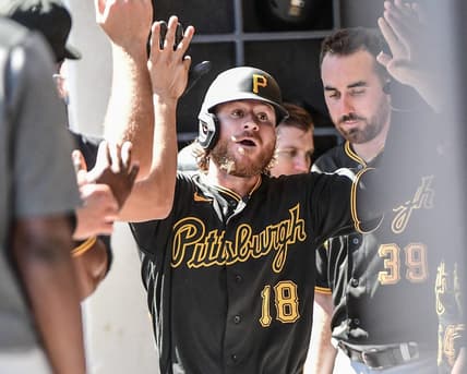 Aug 31, 2022; Milwaukee, Wisconsin, USA;  Pittsburgh Pirates right fielder Ben Gamel (18) is greeted in the dugout after hitting a solo home run in the fourth inning against the Milwaukee Brewers at American Family Field. Mandatory Credit: Benny Sieu-USA TODAY Sports
