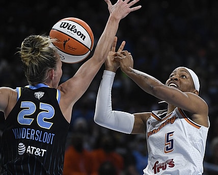 Oct 15, 2021; Chicago, Illinois, USA; Chicago Sky guard Courtney Vandersloot (22) blocks Phoenix Mercury guard Shey Peddy (5) during the first half of game three of the 2021 WNBA Finals at Wintrust Arena. Mandatory Credit: Matt Marton-USA TODAY Sports