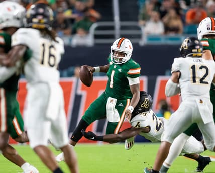 Sep 11, 2021; Miami Gardens, Florida, USA;  Miami Hurricanes quarterback D'Eriq King (1) is pressured by Appalachian State Mountaineers linebacker Brendan Harrington (29) during the second quarter at Hard Rock Stadium. Mandatory Credit: Richard Graulich-USA TODAY Sports
