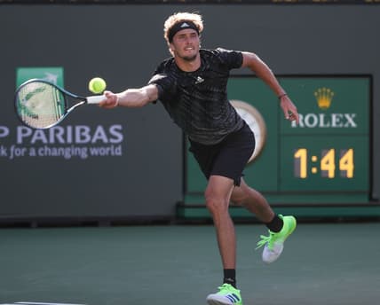 Alexander Zverev reaches for a shot against Taylor Fritz during their quarterfinal match at the BNP Paribas Open in Indian Wells, October 15, 2021.

Bnp Friday 15