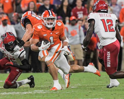 Clemson running back Will Shipley (1) runs near NC State defensive back Devan Boykin (12) during the first quarter at Memorial Stadium in Clemson, South Carolina Saturday, October 1, 2022.

Ncaa Football Clemson Football Vs Nc State Wolfpack