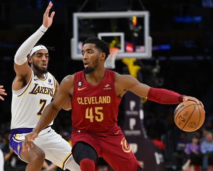 Nov 6, 2022; Los Angeles, California, USA;  Los Angeles Lakers forward Troy Brown Jr. (7) guards Cleveland Cavaliers guard Donovan Mitchell (45) as he drives to the basket in the first half at Crypto.com Arena. Mandatory Credit: Jayne Kamin-Oncea-USA TODAY Sports