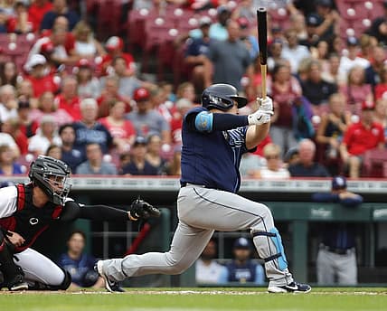 Jul 8, 2022; Cincinnati, Ohio, USA; Tampa Bay Rays first baseman Ji-Man Choi (26) hits an RBI single against the Cincinnati Reds during the third inning at Great American Ball Park. Mandatory Credit: David Kohl-USA TODAY Sports