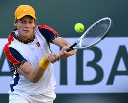 Oct 13, 2021; Indian Wells, CA, USA; Jannik Sinner (ITA) hits a shot against Taylor Fritz (USA) in their fourth round match during the BNP Paribas Open at the Indian Wells Tennis Garden. Mandatory Credit: Jayne Kamin-Oncea-USA TODAY Sports