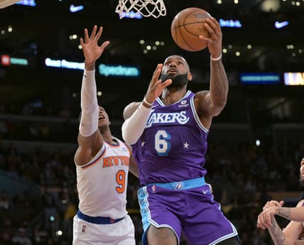 Feb 5, 2022; Los Angeles, California, USA;   Los Angeles Lakers forward LeBron James (6) goes up for a basket past New York Knicks guard RJ Barrett (9) in the second half at Crypto.com Arena. Mandatory Credit: Jayne Kamin-Oncea-USA TODAY Sports