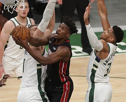 Heat forward Jimmy Butler splits Brook Lopez and forward Giannis Antetokounmpo before scoring Monday night.Mjs Bucks25 4 Jpg Bucks25