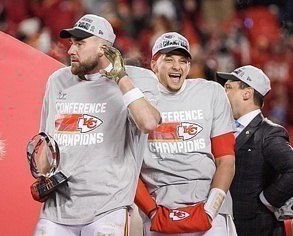 Jan 29, 2023; Kansas City, Missouri, USA; Kansas City Chiefs quarterback Patrick Mahomes (15) and tight end Travis Kelce (87) celebrate after winning the AFC Championship game against the Cincinnati Bengals at GEHA Field at Arrowhead Stadium. Mandatory Credit: Denny Medley-USA TODAY Sports