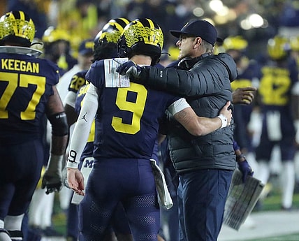 Michigan coach Jim Harbaugh meets quarterback J.J. McCarthy after a touchdown against Purdue during the second half of Michigan's 41-13 win on Saturday, Nov 4, 2023, in Ann Arbor.