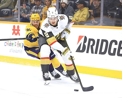 NASHVILLE, TN - MARCH 29: Nashville Predators forward Jonathan Marchessault (81) defends against Vegas Golden Knights defenseman Zach Whitecloud (2) during the NHL game between the Nashville Predators and Vegas Golden Knights, held on March 29, 2025, at Bridgestone Arena in Nashville, Tennessee. (Photo by Danny Murphy/Icon Sportswire)