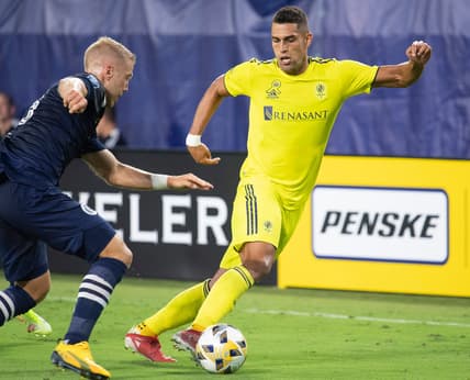 Nashville SC forward Daniel Rios (14) drives past New York City FC defender Anton Tinnerholm (3) during the first half of an MLS game at Nissan Stadium Friday, Sept. 3, 2021 in Nashville, Tenn.

Nas Nashville Sc Nyc Fc 019