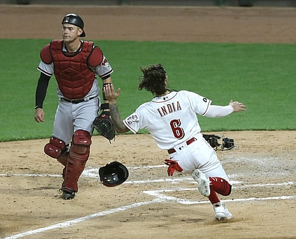 Apr 20, 2021; Cincinnati, Ohio, USA; Cincinnati Reds second baseman Jonathan India (6) scores against Arizona Diamondbacks catcher Carson Kelly (18) during the fourth inning at Great American Ball Park. Mandatory Credit: David Kohl-USA TODAY Sports