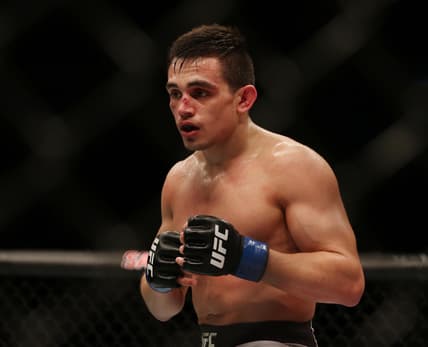 Dec 21, 2019; Busan, SOUTH KOREA; Ryan Benoit (blue gloves) fights Heili Alateng during UFC Fight Night at Sajik Arena. Mandatory Credit: Jasmin Frank-USA TODAY Sports
