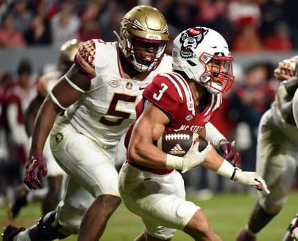 Oct 8, 2022; Raleigh, North Carolina, USA;North Carolina State Wolfpack running back Jordan Houston (3) runs the ball during the first half against the Florida State Seminoles at Carter-Finley Stadium. Mandatory Credit: Rob Kinnan-USA TODAY Sports
