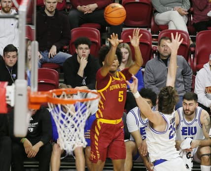 Iowa State Cyclones guard Curtis Jones (5) takes a three-point shot over Eastern Illinois Panthers guard Dan Luers (25) during the first half of a NCAA college basketball at Hilton Coliseum on Thursday, Dec. 21, 2023, in Ames, Iowa.