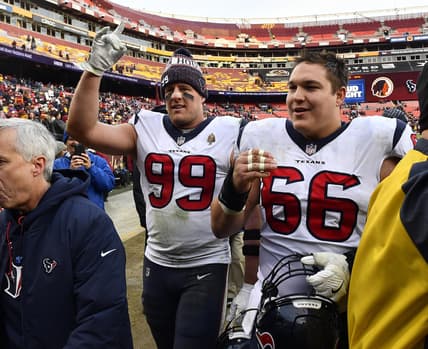 Nov 18, 2018; Landover, MD, USA; Houston Texans defensive end J.J. Watt (99) and center Nick Martin (66) celebrate after defeating the Washington Redskins at FedEx Field. Mandatory Credit: Brad Mills-USA TODAY Sports