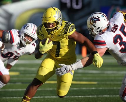 Oregon's CJ Verdell, center, rushes against Stony Brook during the first quarter.

Eug 091821 Oregonfb 07