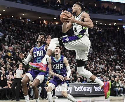 Dec 1, 2021; Milwaukee, Wisconsin, USA; Milwaukee Bucks forward Giannis Antetokounmpo (34) drives for the basket against Charlotte Hornets forward Jalen McDaniels (6) in the fourth quarter at Fiserv Forum. Mandatory Credit: Benny Sieu-USA TODAY Sports