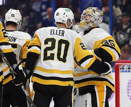 Nov 30, 2023; Tampa, Florida, USA; Pittsburgh Penguins goaltender Tristan Jarry (35) is congratulated after he scored a goal against the Tampa Bay Lightning during the third period at Amalie Arena. Mandatory Credit: Kim Klement Neitzel-USA TODAY Sports