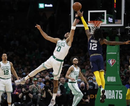 Mar 3, 2022; Boston, Massachusetts, USA; Boston Celtics forward Jayson Tatum (0) and Memphis Grizzlies guard Ja Morant (12) go for a loose ball during the second half at TD Garden. Mandatory Credit: Winslow Townson-USA TODAY Sports