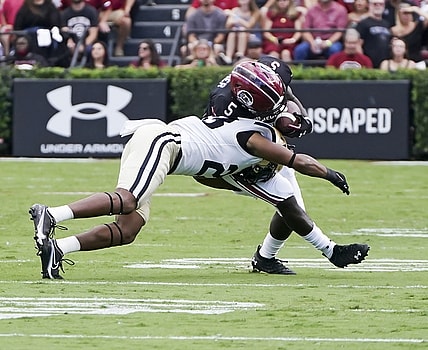 Oct 16, 2021; Columbia, South Carolina, USA; Vanderbilt Commodores cornerback Jaylen Mahoney (23) tackles South Carolina Gamecocks wide receiver Dakereon Joyner (5) at Williams-Brice Stadium. Mandatory Credit: David Yeazell-USA TODAY Sports
