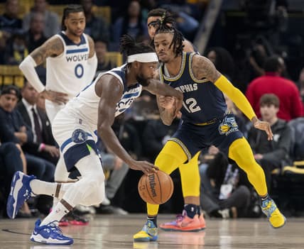 Apr 26, 2022; Memphis, Tennessee, USA; Memphis Grizzlies guard Ja Morant (12) guards Minnesota Timberwolves guard Patrick Beverley (22) during the first half of game five of the first round for the 2022 NBA playoffs at FedExForum. Mandatory Credit: Christine Tannous-USA TODAY Sports