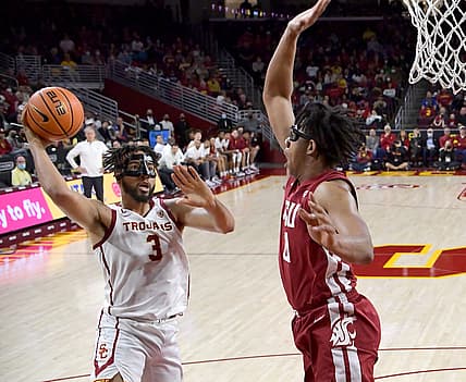 Feb 20, 2022; Los Angeles, California, USA;  USC Trojans forward Isaiah Mobley (3) is defended by Washington State Cougars center Dishon Jackson (21) as he goes up for a basket in the first half of the game at Galen Center. Mandatory Credit: Jayne Kamin-Oncea-USA TODAY Sports