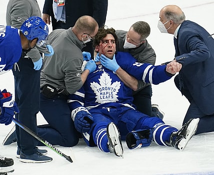 May 20, 2021; Toronto, Ontario, CAN; Toronto Maple Leafs medical staff attend to forward John Tavares (91) after a collision with Montreal Canadiens forward Corey Perry (not pictured) during the first period of game one of the first round of the 2021 Stanley Cup Playoffs at Scotiabank Arena. Mandatory Credit: John E. Sokolowski-USA TODAY Sports