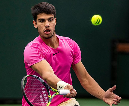 Carlos Alcaraz of Spain hits to Daniil Medvedev of Russia during the men's singles final at the BNP Paribas Open of the Indian Wells Tennis Garden in Indian Wells, Calif., Sunday, March 19, 2023.