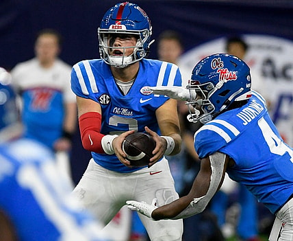 Mississippi's quarterback Jaxson Dart (2), left, prepares to hand off the ball to Mississippi's running back Quinshon Judkins (4) in the Texas Bowl game against Texas Tech, Wednesday, Dec. 28, 2022, at NRG Stadium in Houston.

Syndication Lubbock Avalanche Journal