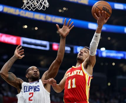 Jan 8, 2023; Los Angeles, California, USA;  Atlanta Hawks guard Trae Young (11) shoots the ball against Los Angeles Clippers forward Kawhi Leonard (2) during the second quarter at Crypto.com Arena. Mandatory Credit: Kiyoshi Mio-USA TODAY Sports