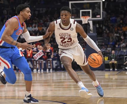 Mar 8, 2023; Nashville, TN, USA;  South Carolina Gamecocks forward Gregory Jackson II (23) drives past Mississippi Rebels forward Myles Burns (3) during the second half at Bridgestone Arena. Mandatory Credit: Steve Roberts-USA TODAY Sports