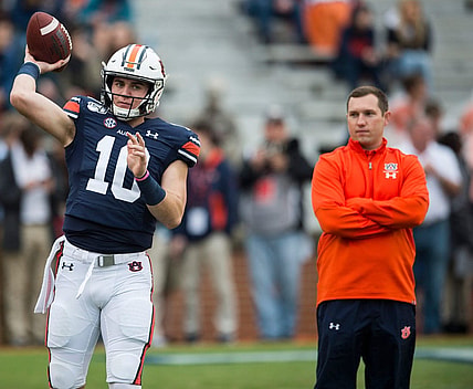 Auburn quarterback Bo Nix (10) throws the ball as Auburn offensive coordinator Kenny Dillingham watches on during warm ups at Jordan-Hare Stadium in Auburn, Ala., on Saturday, Nov. 23, 2019.

Jc Auburnsamford 19