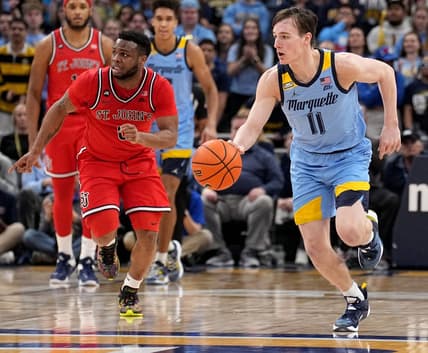 Marquette guard Tyler Kolek (11) is shown on a fast break  during the first half of their game against St. John   s Saturday, March 4, 2023 at Fiserv Forum in Milwaukee, Wis.

Mumen04 11