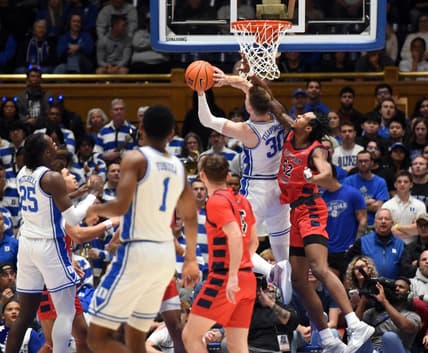 Nov 24, 2023; Durham, North Carolina, USA; Duke Blue Devils center Kyle Filipowski (30) shoots the ball in front of Southern Indiana Screaming Eagles center Kiyron Powell (52) during the first half at Cameron Indoor Stadium. Mandatory Credit: Rob Kinnan-USA TODAY Sports