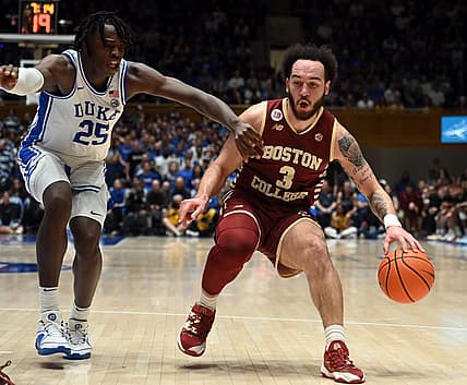 Feb 10, 2024; Durham, North Carolina, USA; Boston College Eagles guard Jaeden Zackery (3) controls the ball against Duke Blue Devils forward Mark Mitchell (25) during the first half  at Cameron Indoor Stadium. Mandatory Credit: Rob Kinnan-USA TODAY Sports