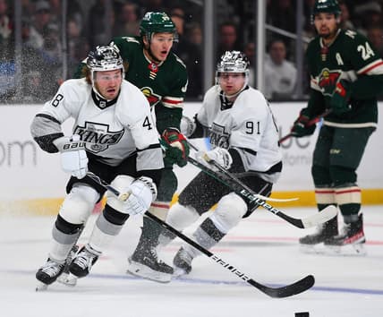Dec 11, 2021; Los Angeles, California, USA;  Los Angeles Kings left wing Brendan Lemieux (48) and Minnesota Wild left wing Kirill Kaprizov (97) chase down the puck in the third period of the game at Staples Center. Mandatory Credit: Jayne Kamin-Oncea-USA TODAY Sports