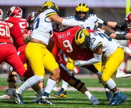 Indiana's Connor Bazelak (9) is sacked by Michigan's Michael Barrett (23) during the Indiana versus Michigan football game at Memorial Stadium on Saturday, Oct. 8, 2022.

Iu Mu Fb 1h Bazelak Sack