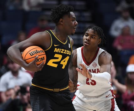 Mar 11, 2023; Nashville, TN, USA; Missouri Tigers guard Kobe Brown (24) is defended by Alabama Crimson Tide forward Nick Pringle (23) during the first half at Bridgestone Arena. Mandatory Credit: Christopher Hanewinckel-USA TODAY Sports