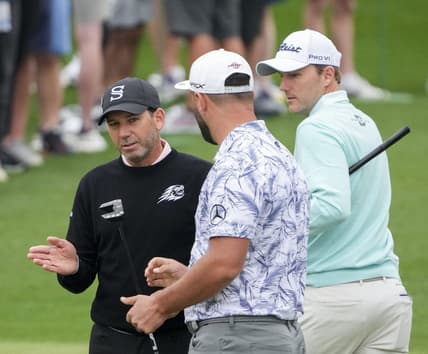 Apr 3, 2023; Augusta, Georgia, USA; Sergio Garcia (from left), Jon Rahm and Russell Henley talk at the practice facility during a practice round for The Masters golf tournament at Augusta National Golf Club. Mandatory Credit: Danielle Parhizkaran-USA TODAY Network

Pga The Masters Practice Round